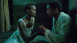 Chiwetel Ejiofor with breakout star Lupita Nyong'o in Steve McQueen's Academy-Award winning drama, 12 Years a Slave.