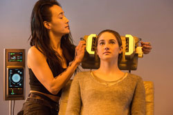 Maggie Q subjects Shailene Woodley to some tests in the 2014 top sci-fi film, Divergent.